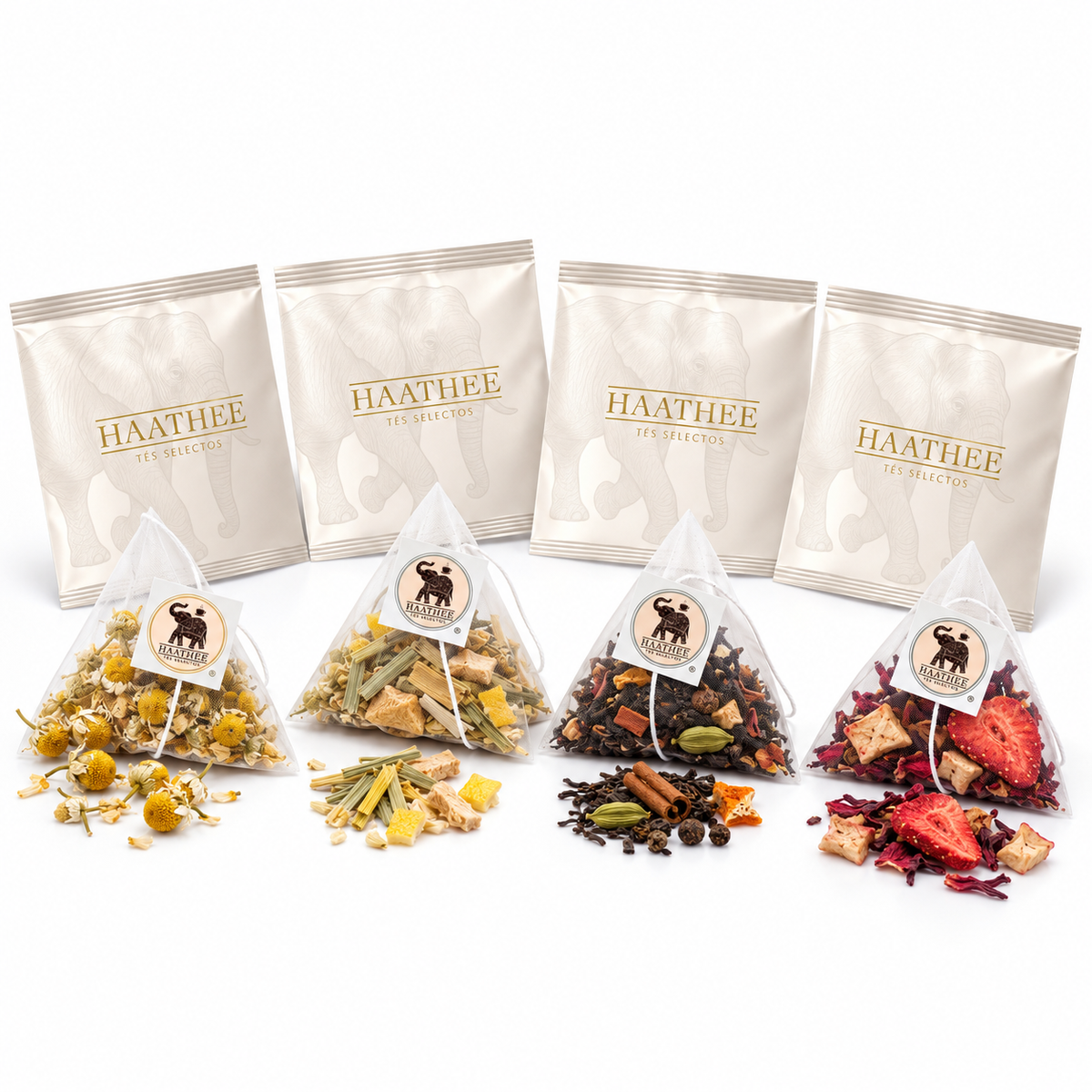 Cuatro sachets piramidales Haathee Deluxe con sus sobres: Manzanilla, Jengibre Limón, Indian Chai y Frutos Rojos